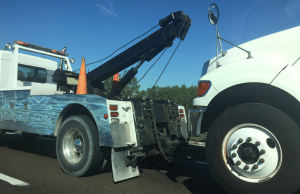 Flatbed Tow Truck vs Hook and Chain: Which Is Better?